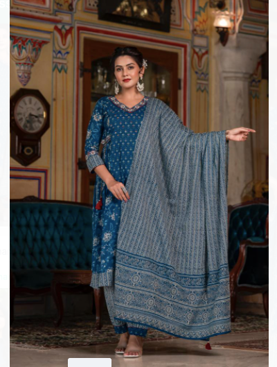 The Indigo Blue Cotton Indian outfits like Salwar Suit Dupatta Set is a beautiful and stylish ethnic outfit for women. Made from high-quality cotton fabric, it is comfortable to wear and perfect for the summer season.This set includes a long kurta (top), salwar (bottoms), and a dupatta (scarf). The kurta features a trendy indigo blue color with intricate embroidery work on the yoke and sleeves. It also has a round neckline and three-quarter sleeves, adding a touch of elegance to the overall look.