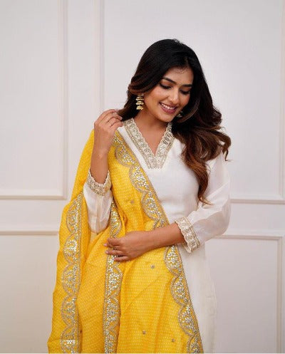 Ivory Heavy Muslin Silk Salwar Suit With Yellow Chiffon Dupatta